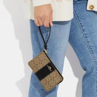 Coach Corner Zip Wristlet In Signature Canvas